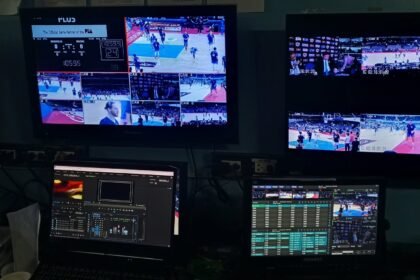A production monitor showing the live PBA broadcast during a behind-the-scenes production setup.