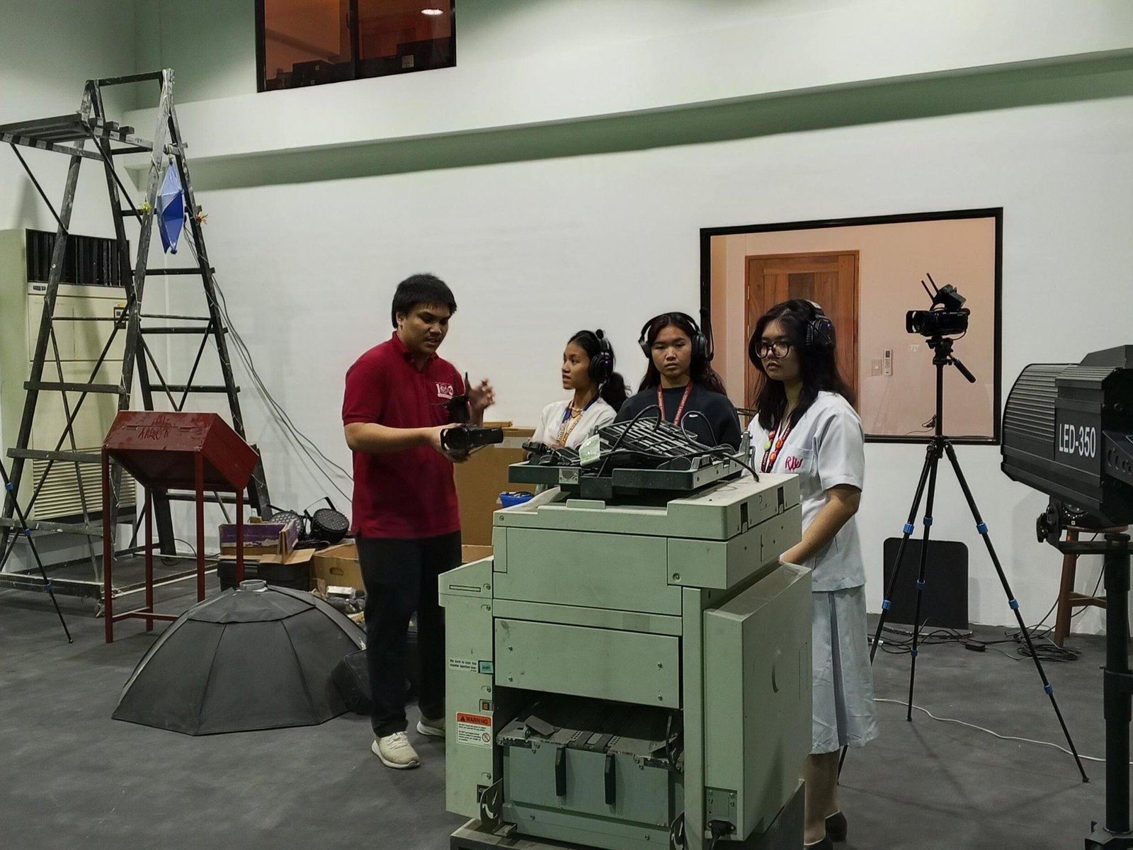 prepares in the Multimedia Green Room at Philippine Women’s University before an event.