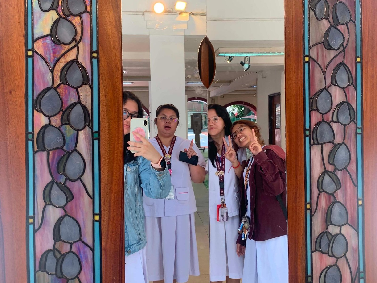 takes a mirror selfie inside HZB Hall at Philippine Women’s University.