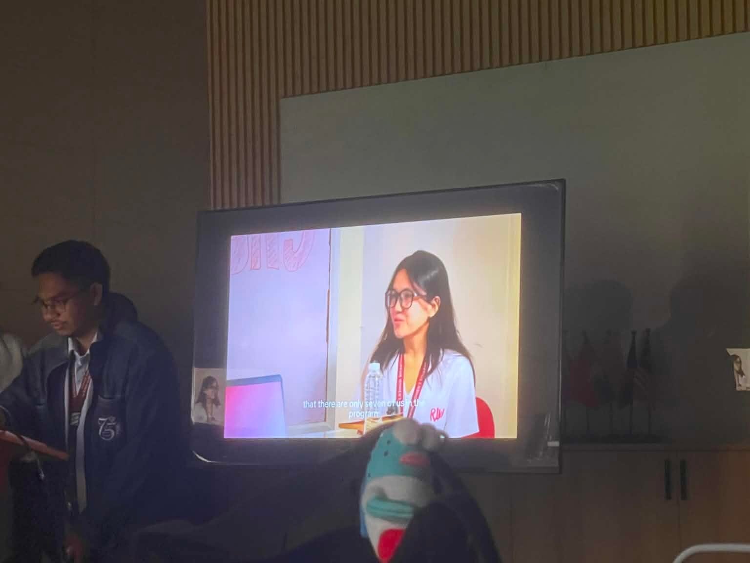 A student is being watched during a podcast feature.